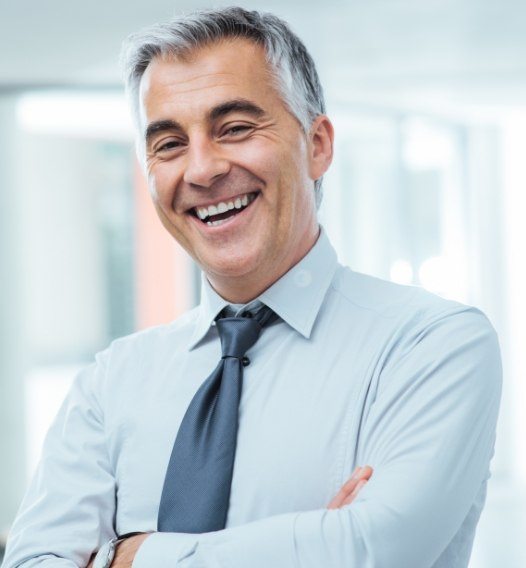 Man sharing healthy smile after partial denture placement