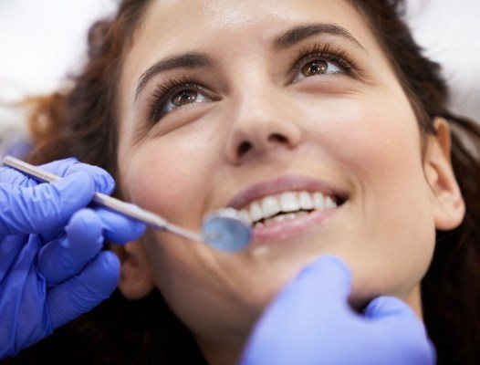 Woman receiving dental exam