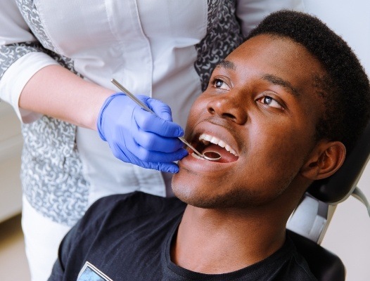Patient receiving oral cancer screening