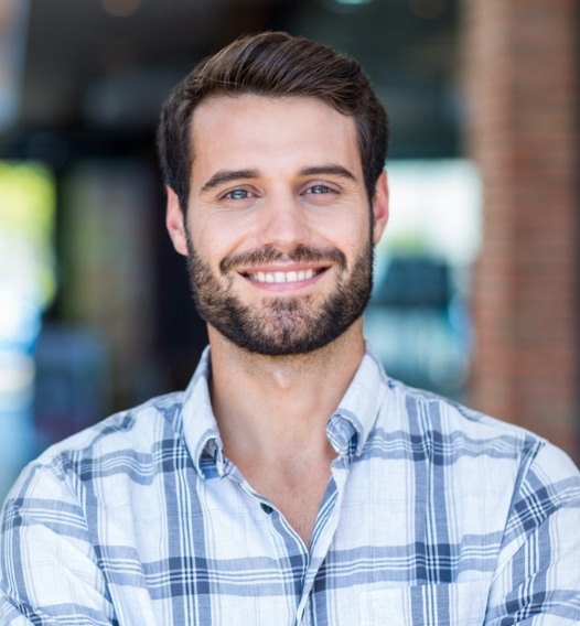 Man with healthy smile after root canal therapy