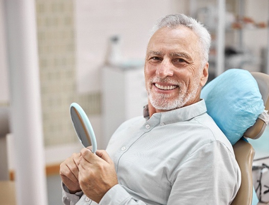 Man learning cost of root canal in Phoenix