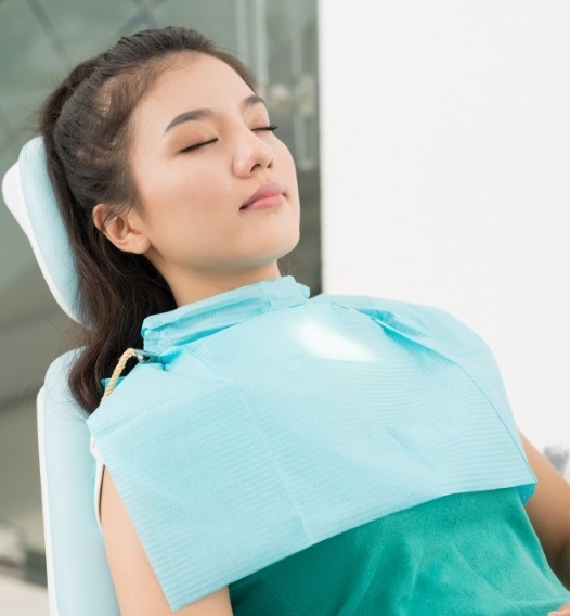 Woman relaxing during sedation dentistry visit